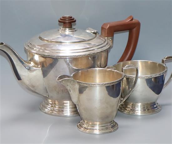 A George V Art Deco silver three-piece tea service of circular form Birmingham 1935, Makers Mappin & Webb gross 21 oz.